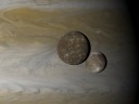 Ganymede and Callisto in front of Jupiter